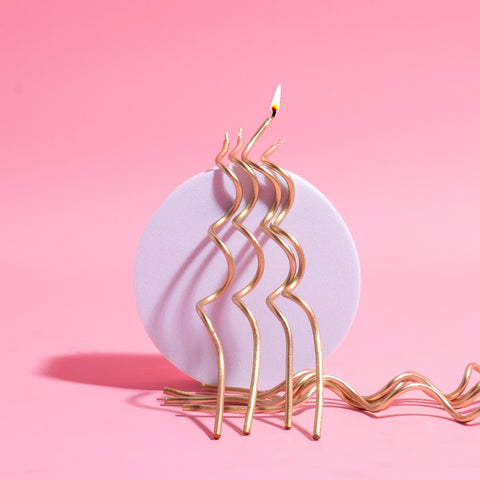 GOLD SWIRLY CANDLES 16pk